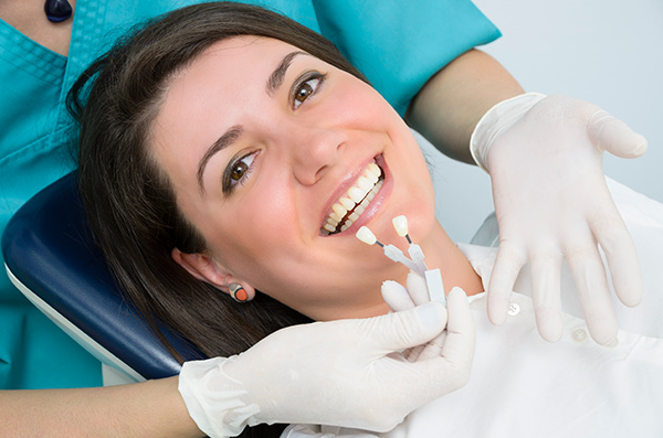 Woman at the dentist with new dental implants.