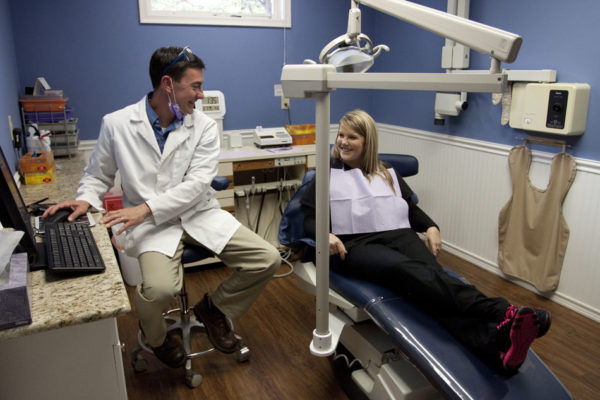 Dr. Matt cleans a patient's teeth in Millbury, Oh family dental care office