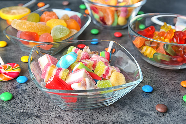 Bowls full of hard or sticky foods that damage teeth